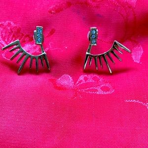 “BARNEYS” gold earrings with stones. Very cool on